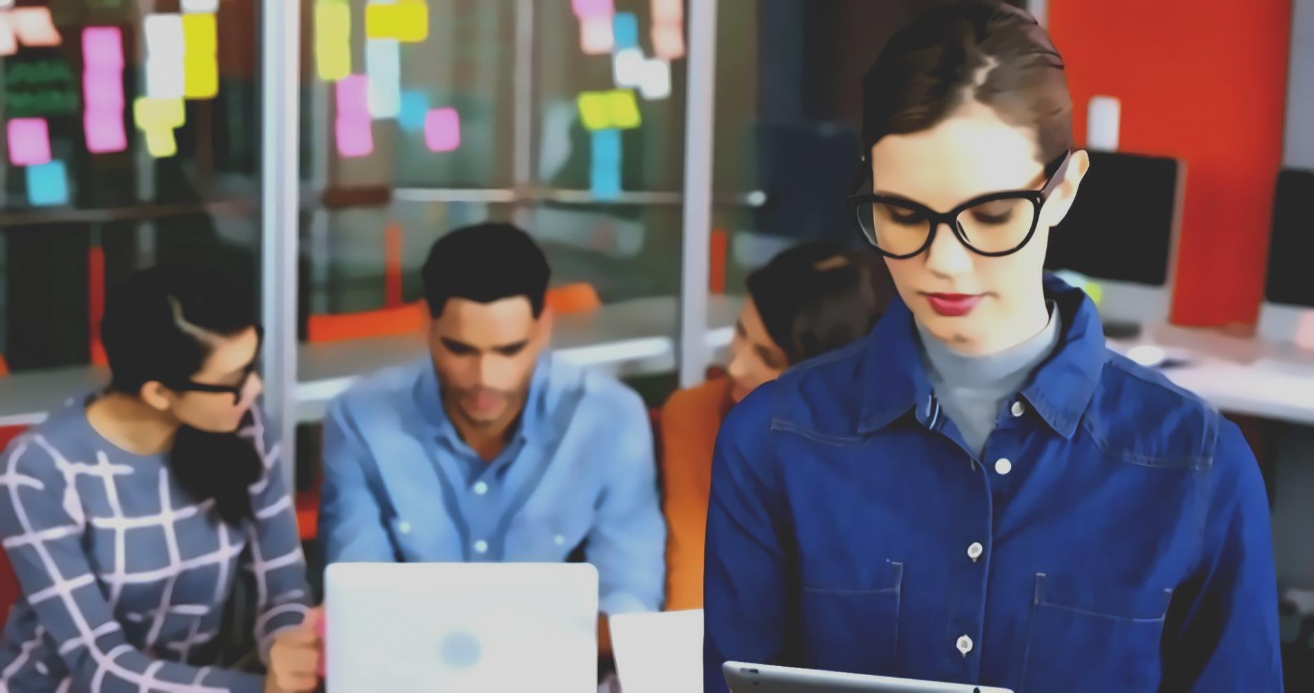 Insurance professionals analyzing blockchain transaction data on multiple screens